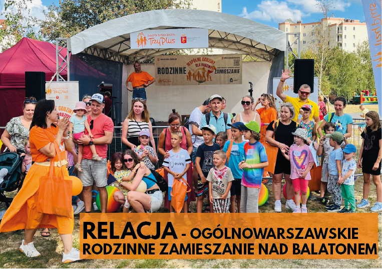 Grupa osób stojącą przed namiotem 